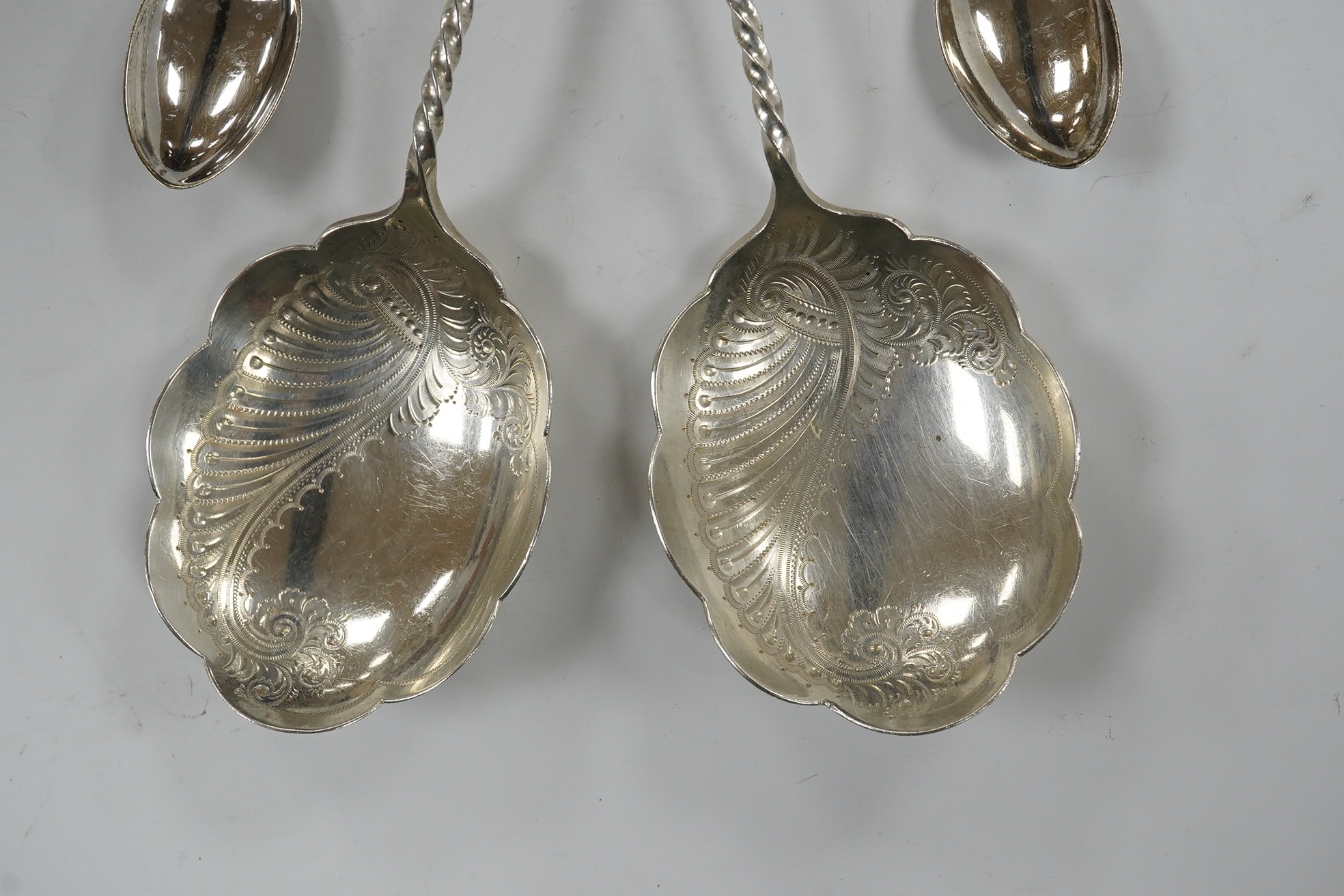 A pair of Edwardian silver serving spoons, Sheffield, 1901, 21.6cm and a quantity of assorted minor silver flatware. Condition - poor to fair
